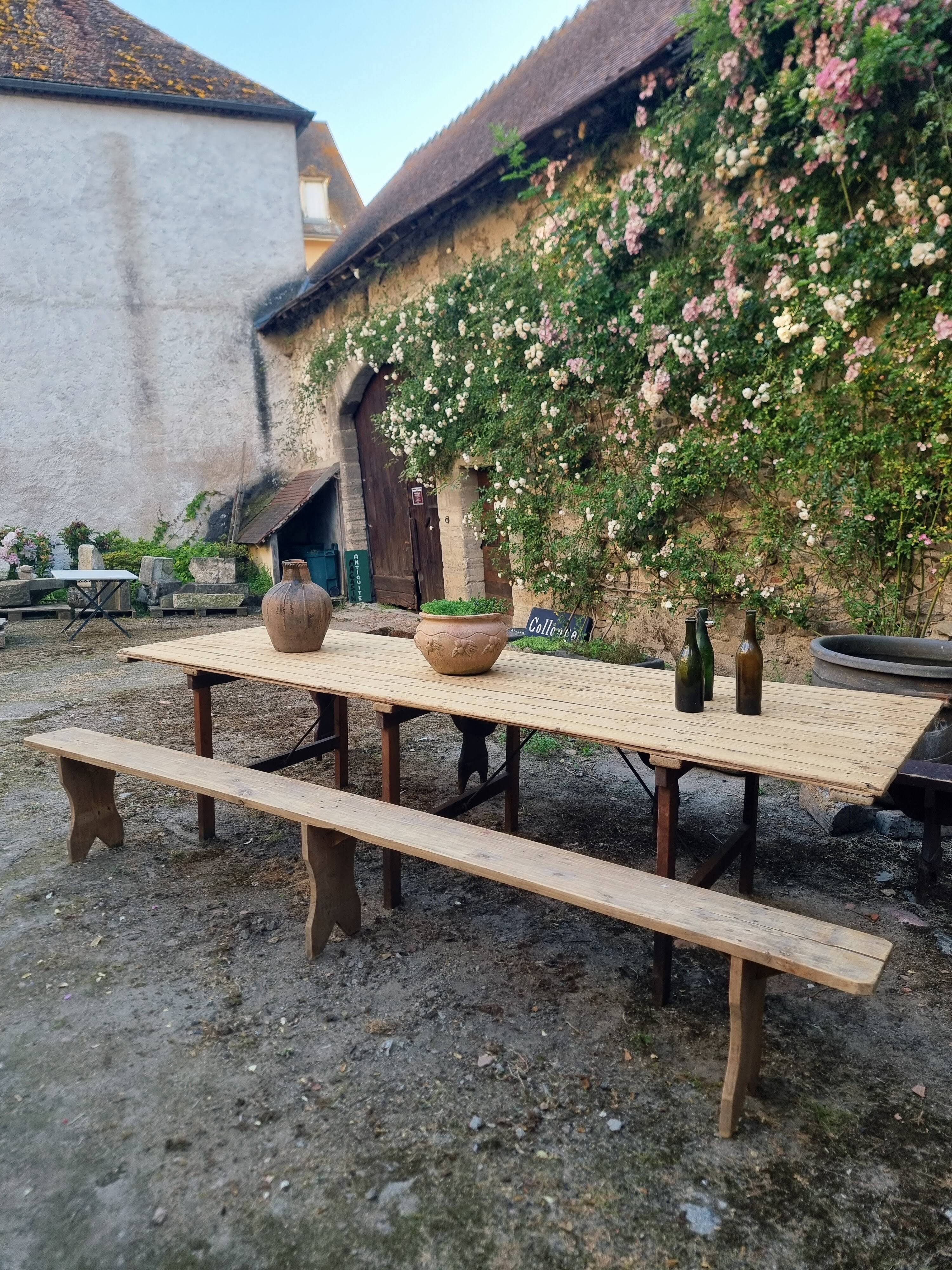 Antique French folding garden table set with benches, pine and chestnut, circa 1900–1920.