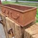 Rusty cast iron jardiniere planter