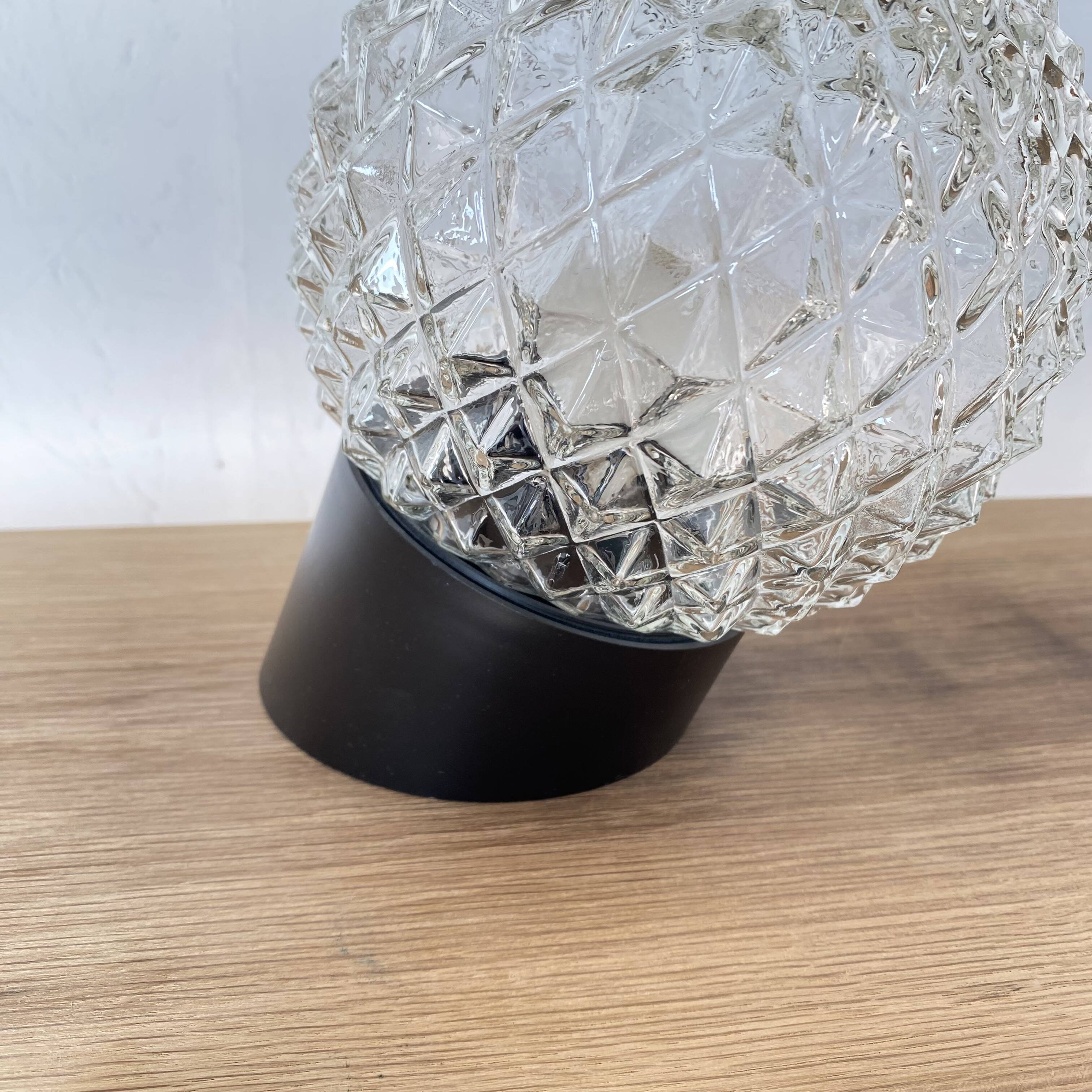 Pair of slanted glass wall lights with black plastic base, decorative v