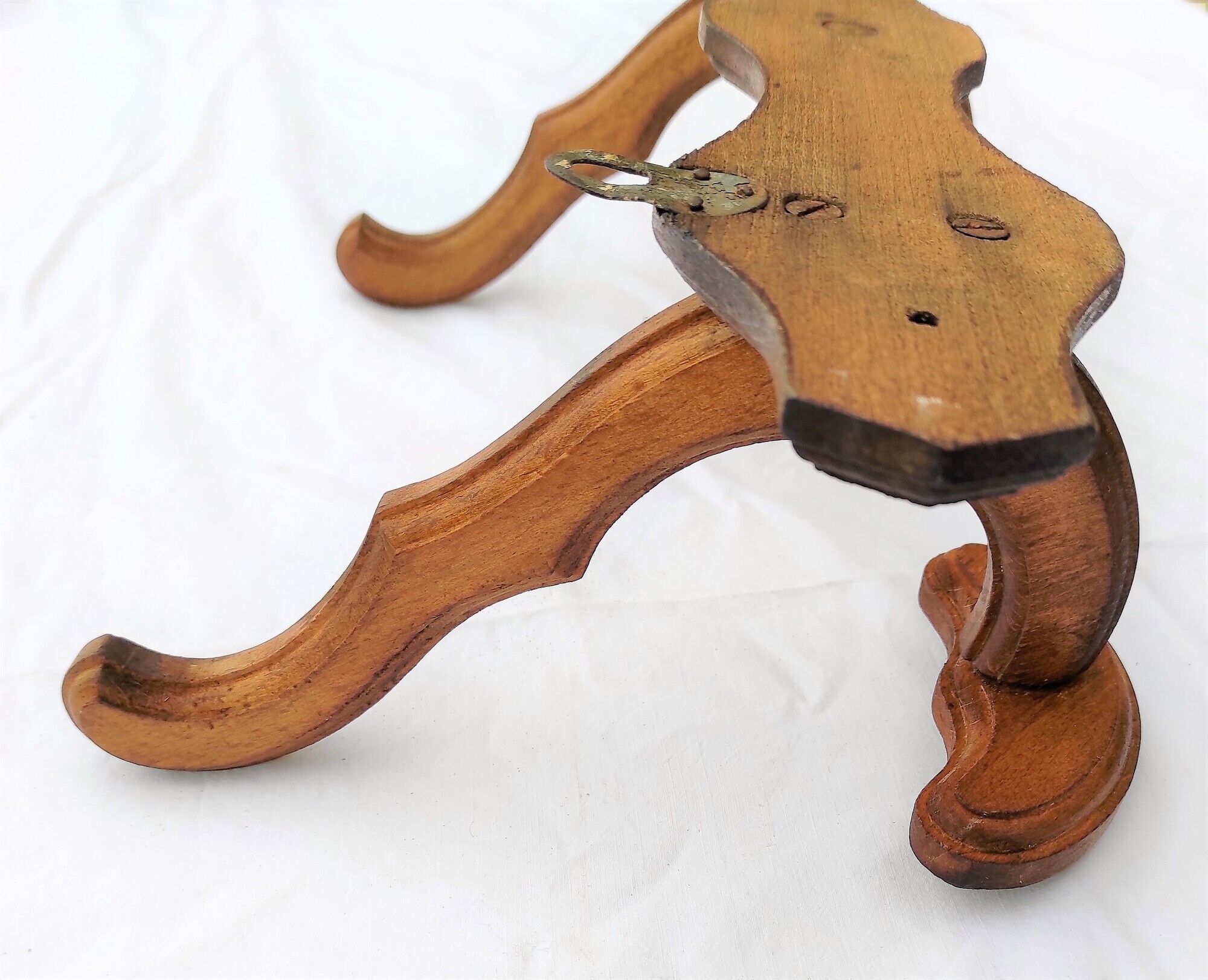 Wooden coats door with hat hanging in the center circa 1930
