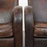 Set of two vintage sheepskin leather design armchairs in a cognac colour