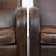 Set of two vintage sheepskin leather design armchairs in a cognac colour