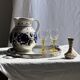 Very large vintage ceramic carafe in white glazed with blue floral decoration.