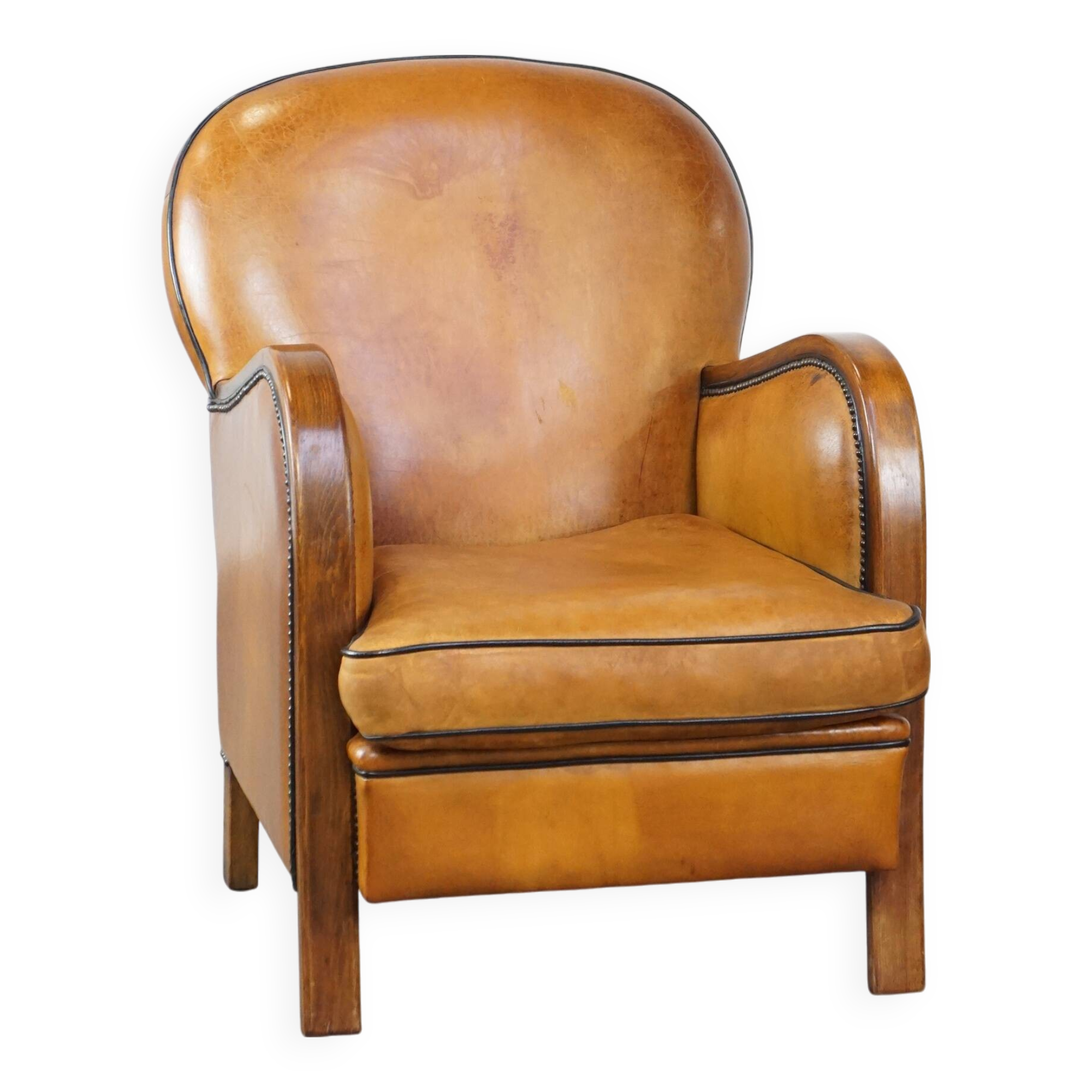 Unique, luxurious sheepskin armchair combined with wood and finished with decorative nails