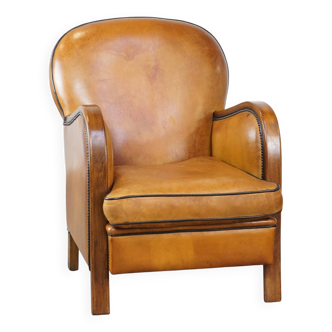 Fauteuil en cuir de mouton marron et clous de tapissier