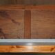 Vintage wooden furniture for 45 wine bottles with a drawer.
