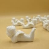12 porte-couteaux vintage en porcelaine figurant des chérubins