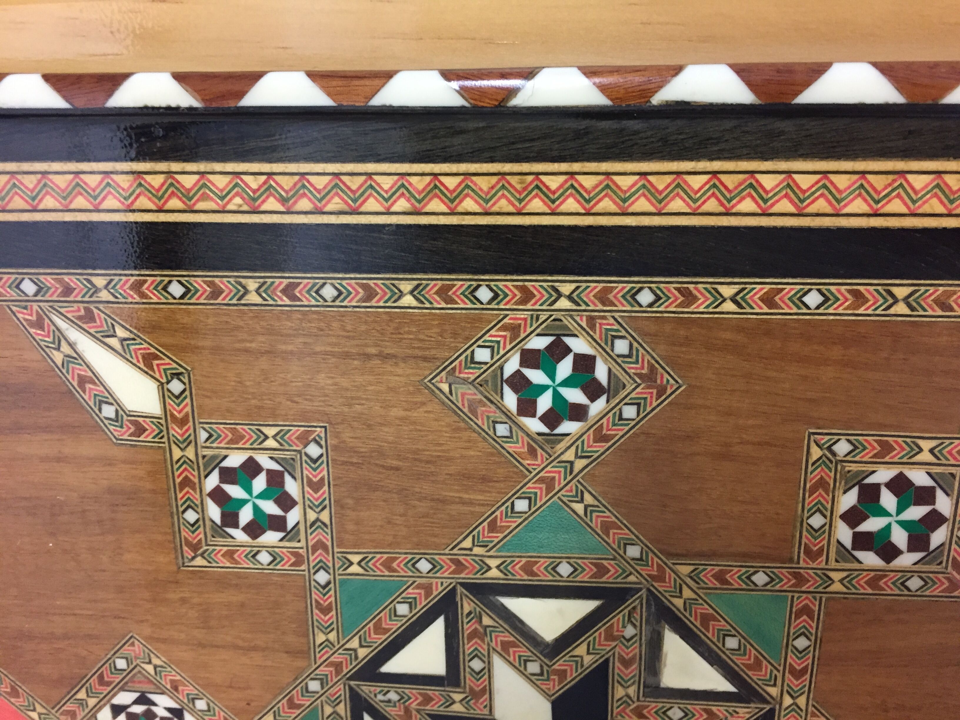 Old geometric marquetry top design'