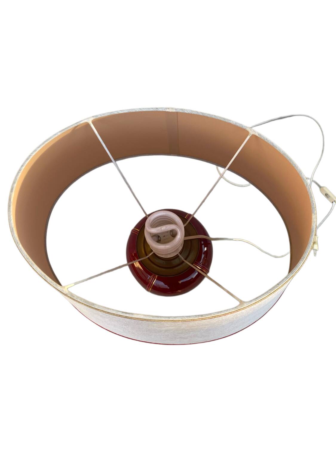 Large burgundy and gold table lamp in vase style.