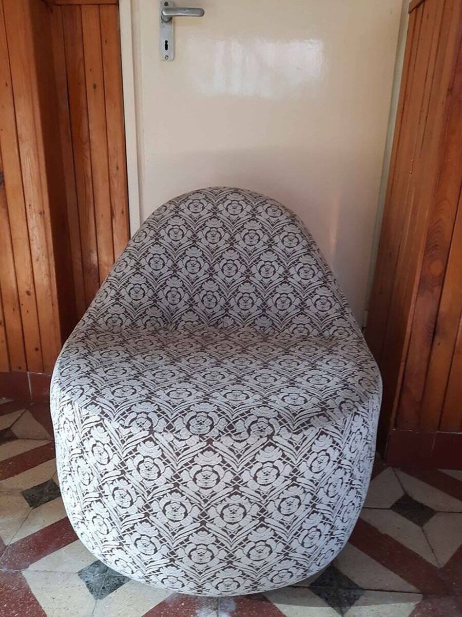 1970s vintage armchair in multicoloured patterned fabric, rounded silhouette