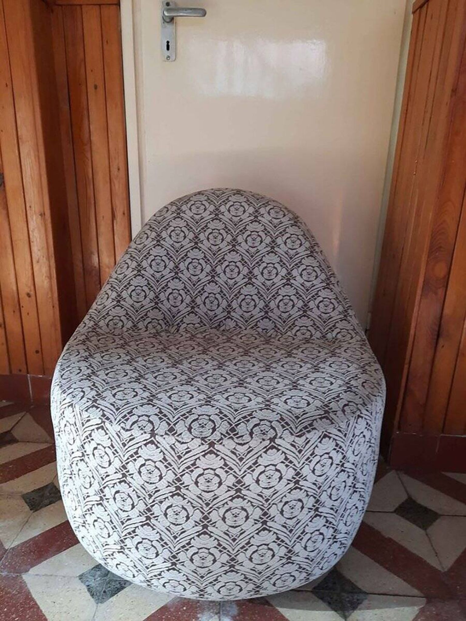 1970s vintage armchair in multicoloured patterned fabric, rounded silhouette