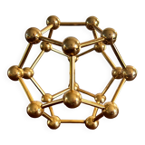 Golden brass atom