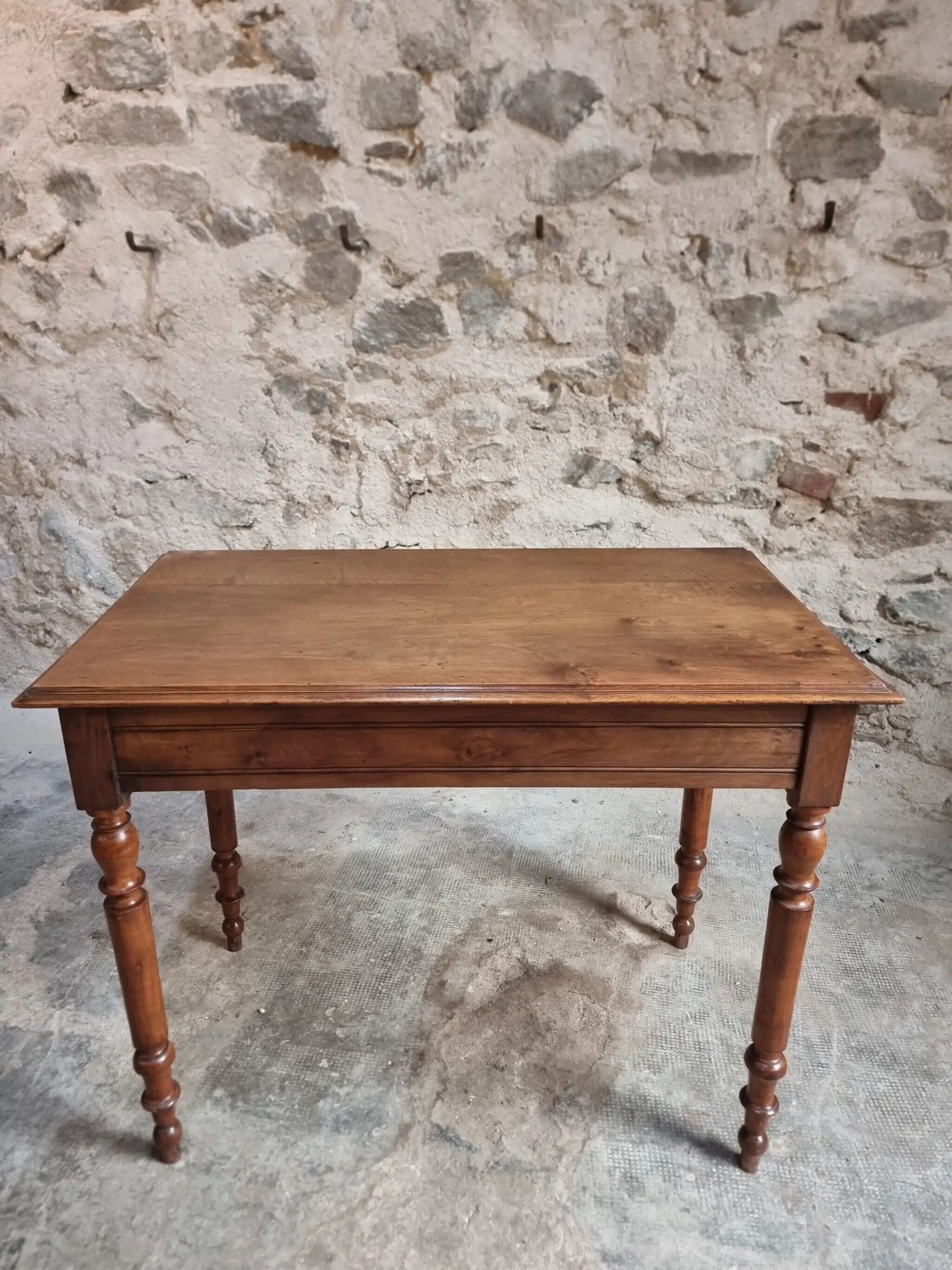 Antique French writing table in walnut with a drawer, circa 1900.
