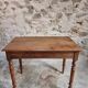 Antique French writing table in walnut with a drawer, circa 1900.