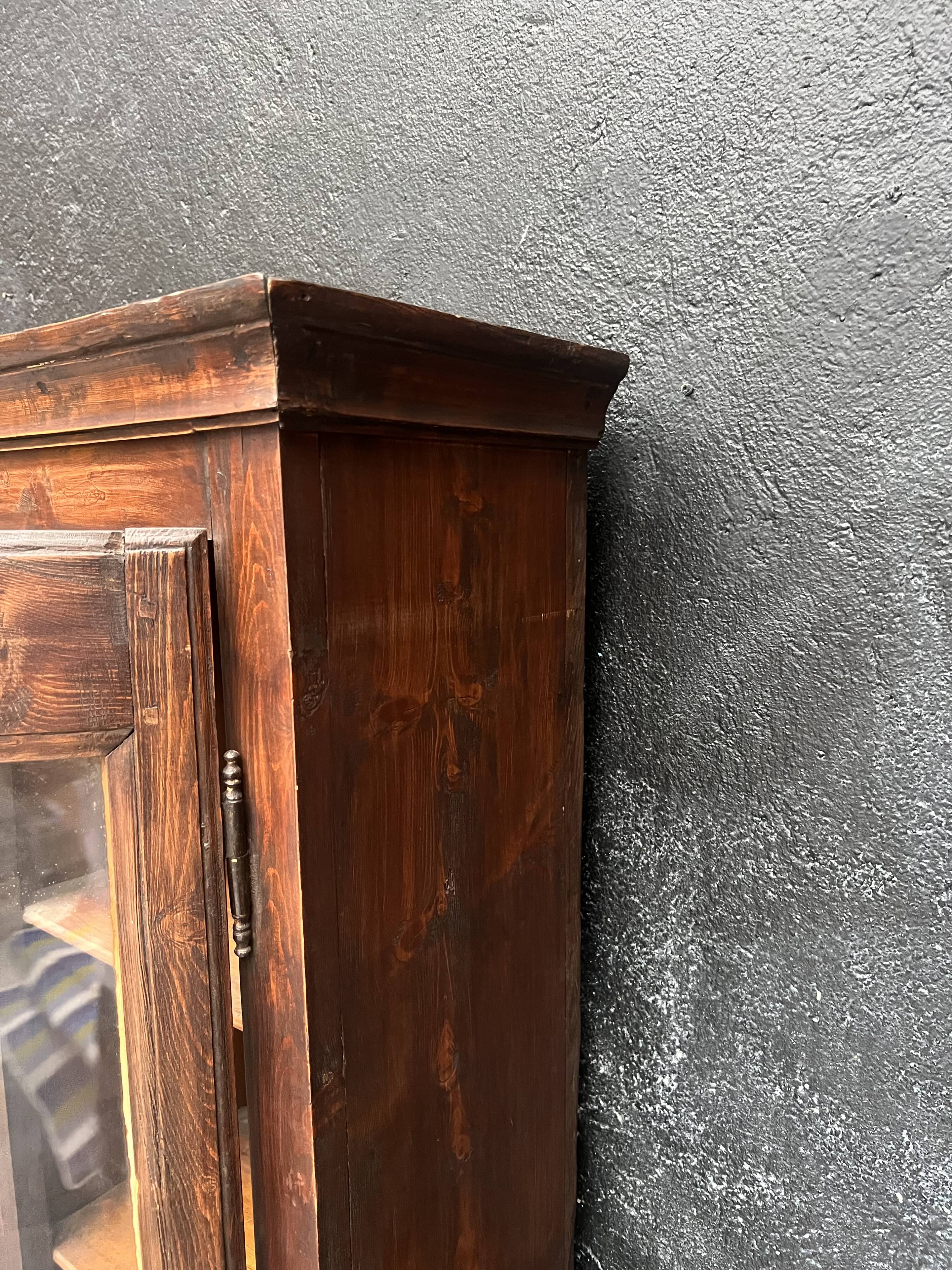 Old narrow wooden showcase.