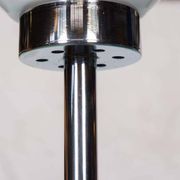 Vintage floor lamp in milky glass and chrome, minimalist uplight lighting.