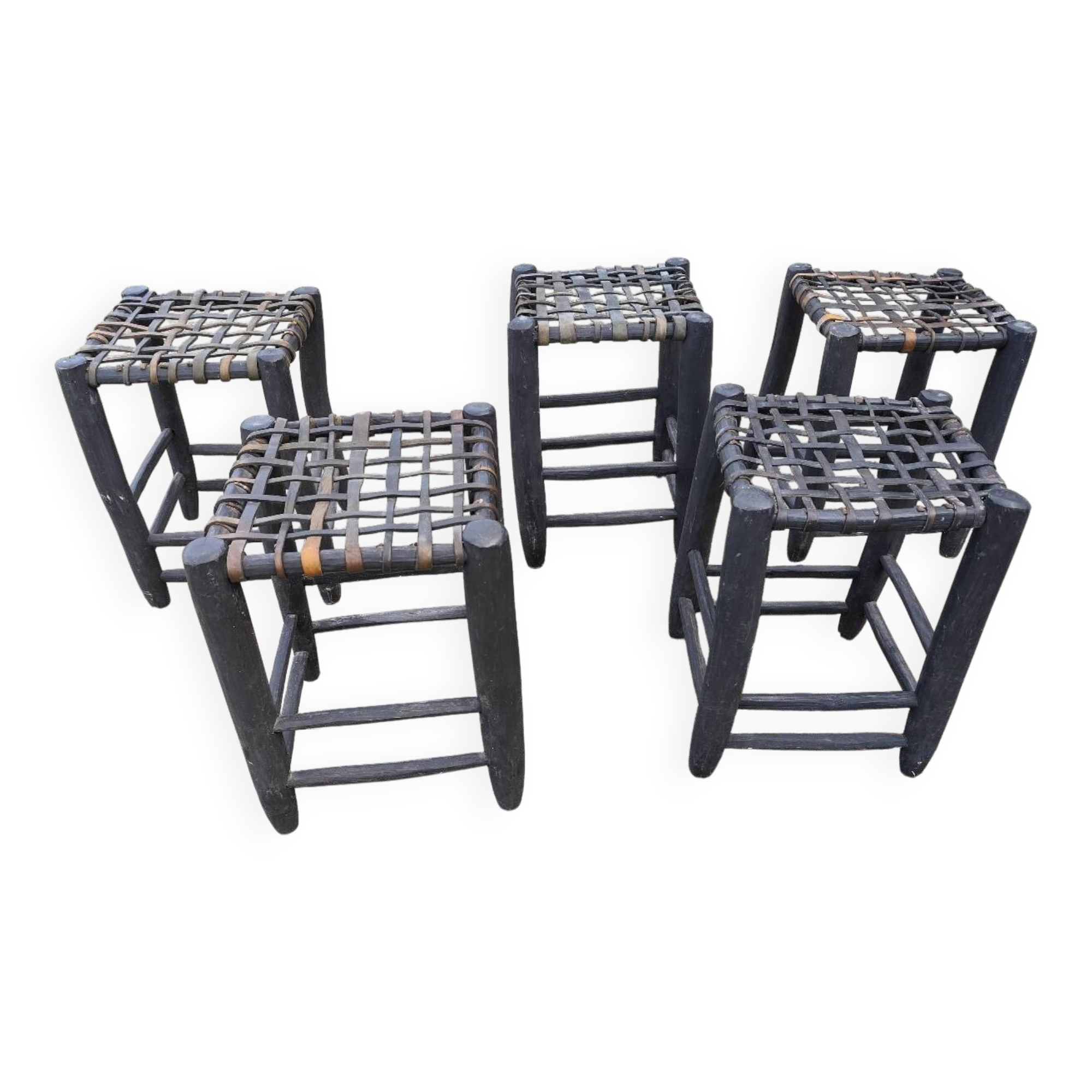 5 blackened wooden stools with woven leather seats by Nina Kaufmann