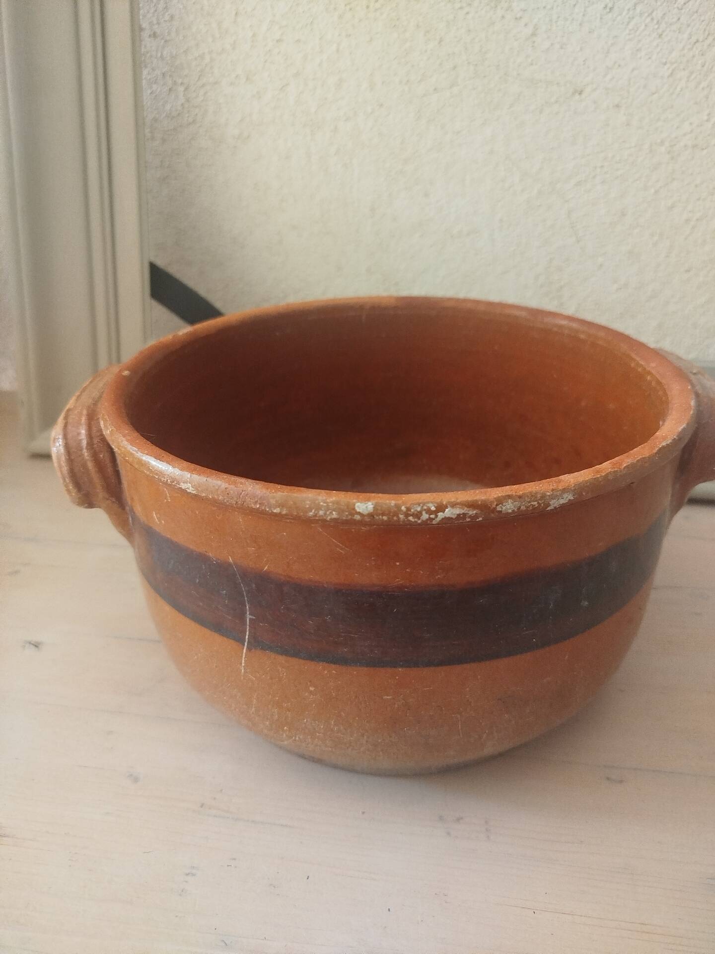 Old terracotta casserole