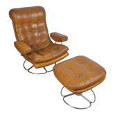 Fauteuil pivotant et son ottoman en cuir