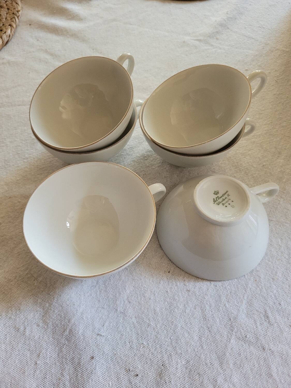 6 white and gold porcelain cups