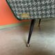 Retro armchair from around 1960 in forest green with houndstooth pattern.