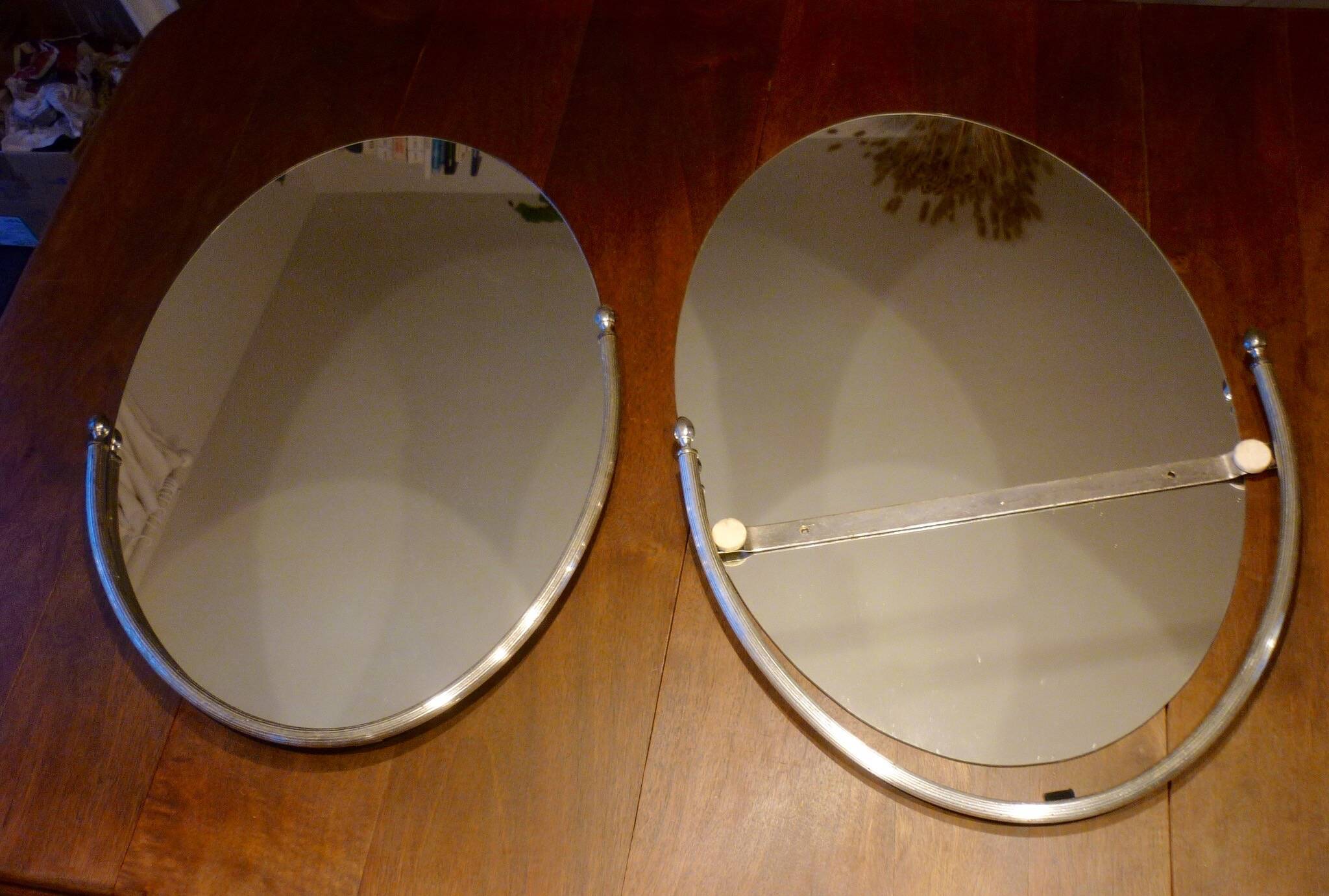 2 bathroom mirrors in silver oval holders