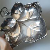 Old empty cut pocket in silver metal art nouveau in the shape of a sheet