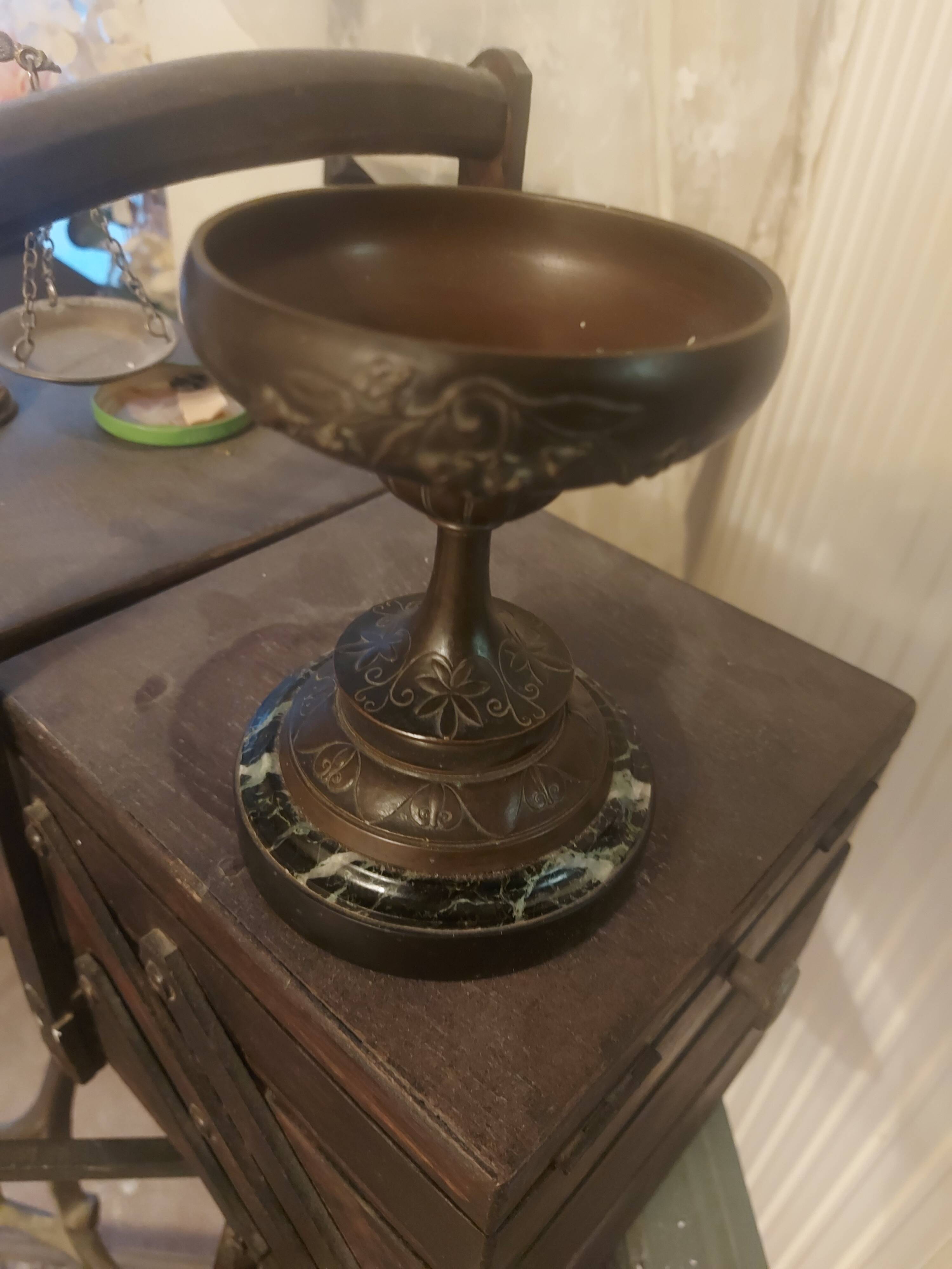 Bronze bowl on marble base