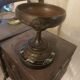 Bronze bowl on marble base