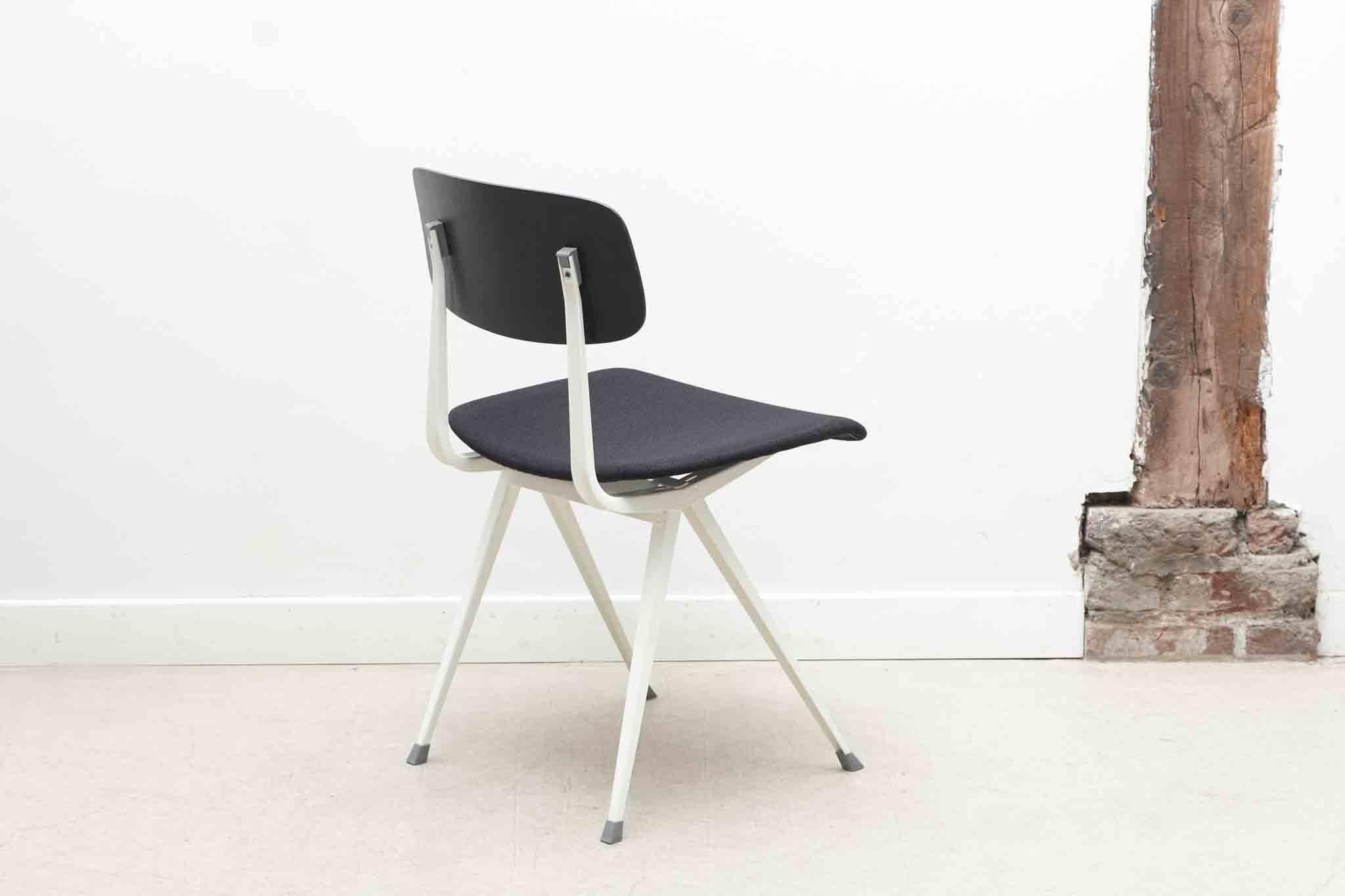 Friso Kramer "Result" chair upholstered in black and white.