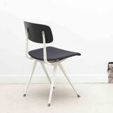 Friso Kramer "Result" chair upholstered in black and white.