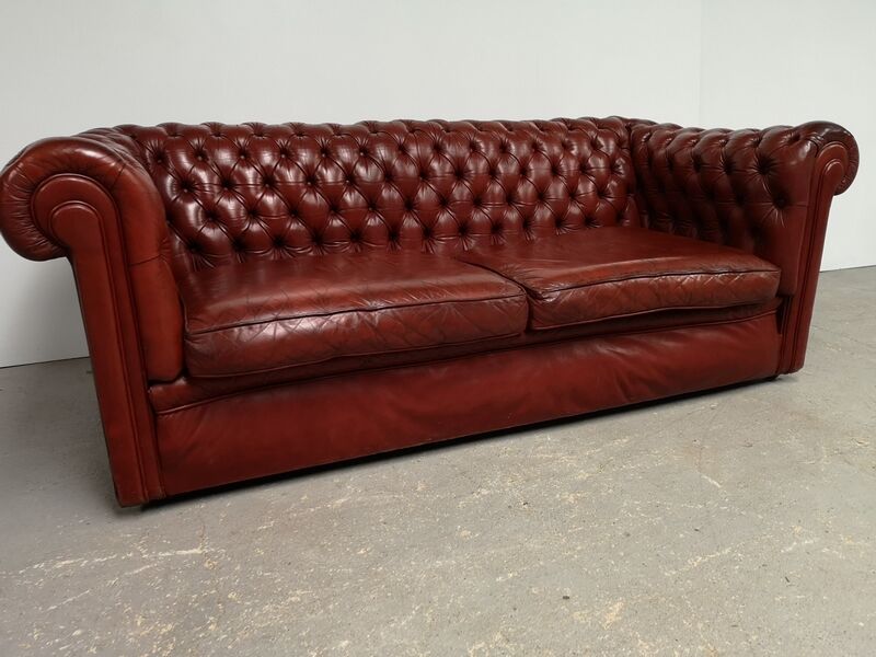 Old red leather Chesterfield sofa