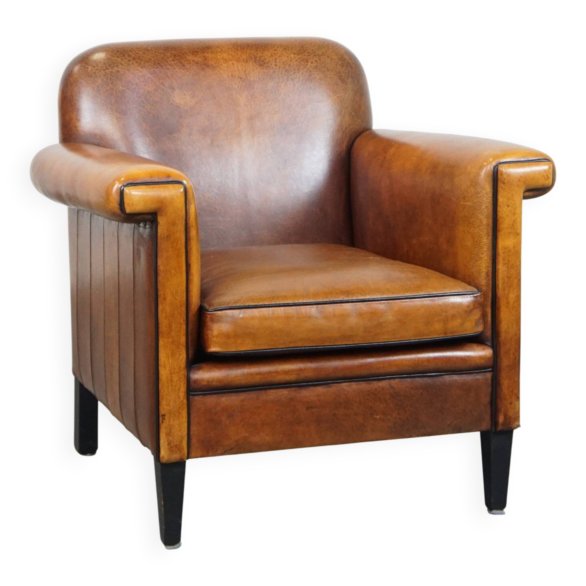 Sheepskin Art Deco design armchair with sleek finish and black piping