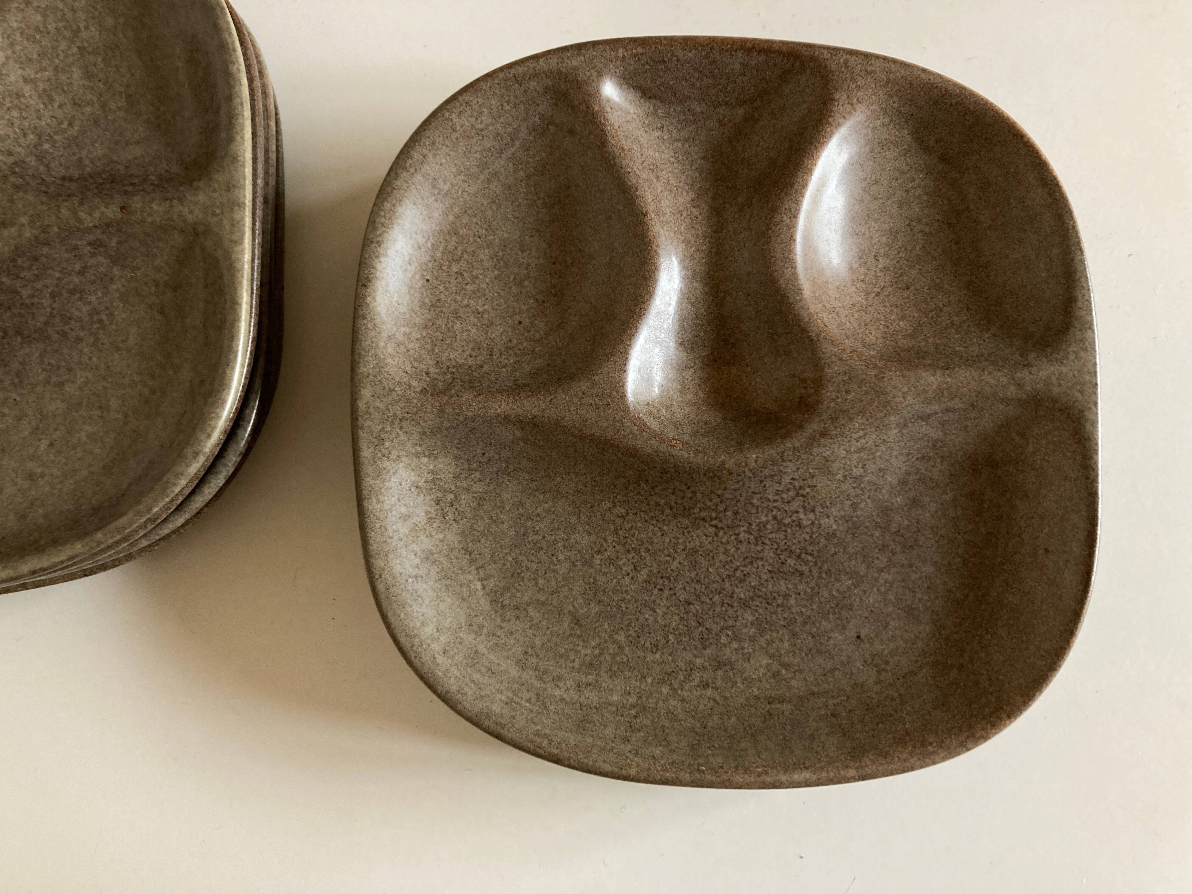 Set of 8 mid century modern stoneware potter's plates to identify