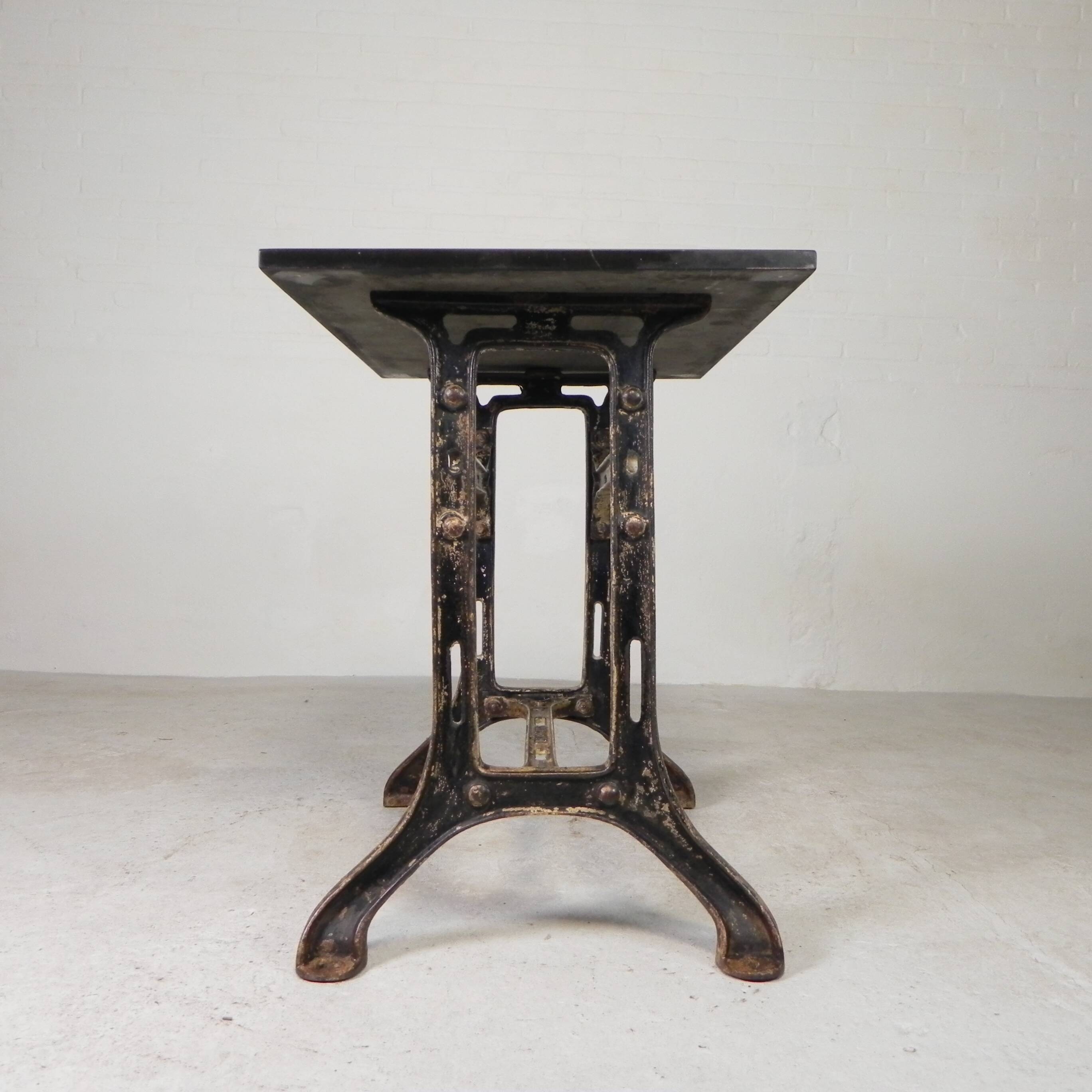 Industrial table, garden table with hard stone slab on cast iron frame, 1930s