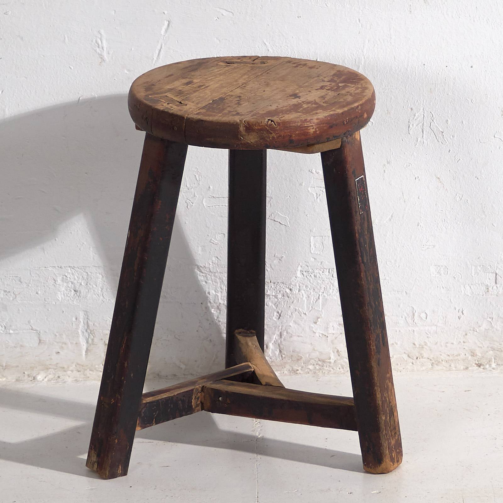 Antique round dark colored stool (c.1900)