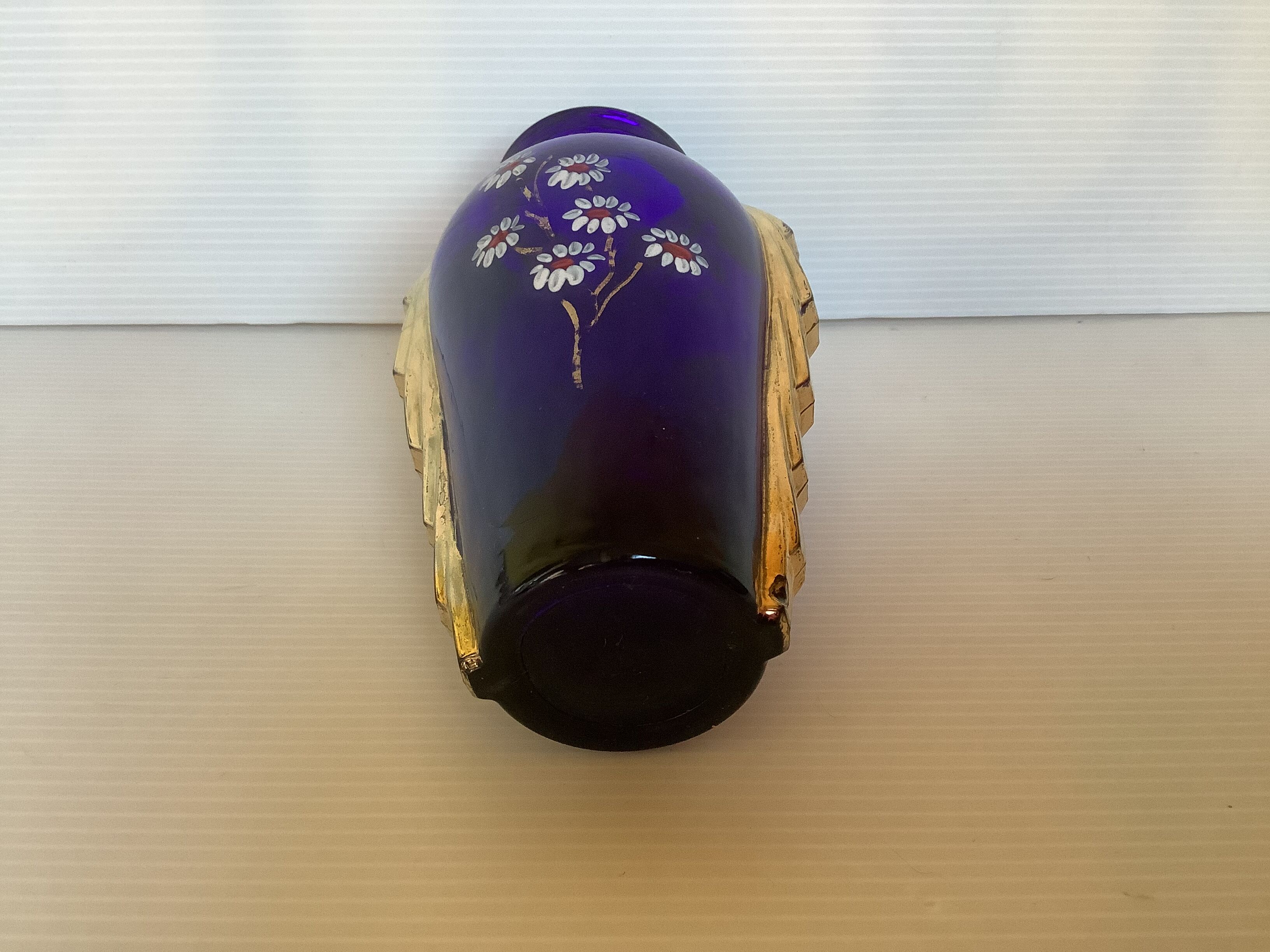 Antique blue and gold glass vase with flower pattern