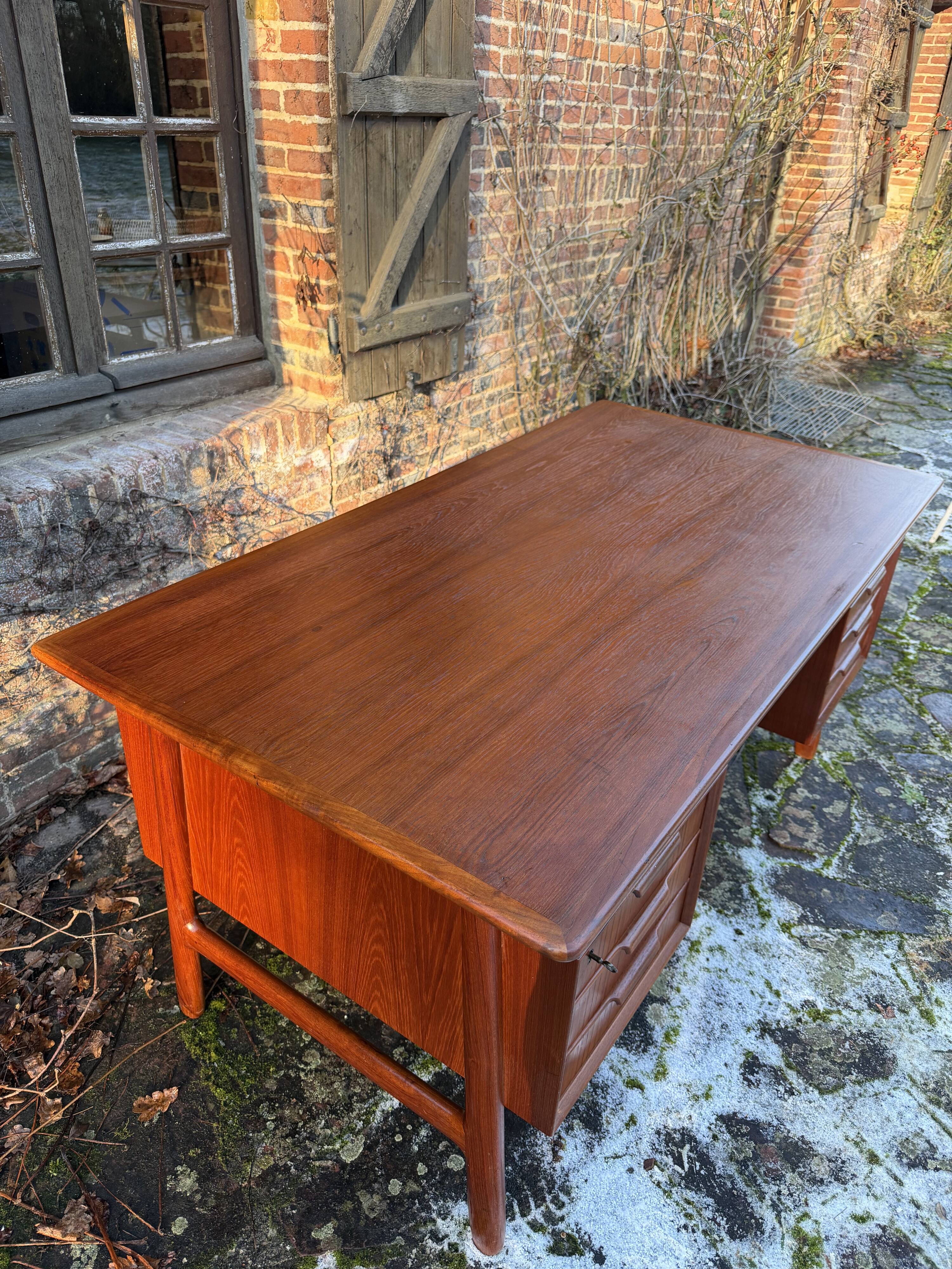 Danish teak desk Gunni Omann no. 75 from the 1960s.