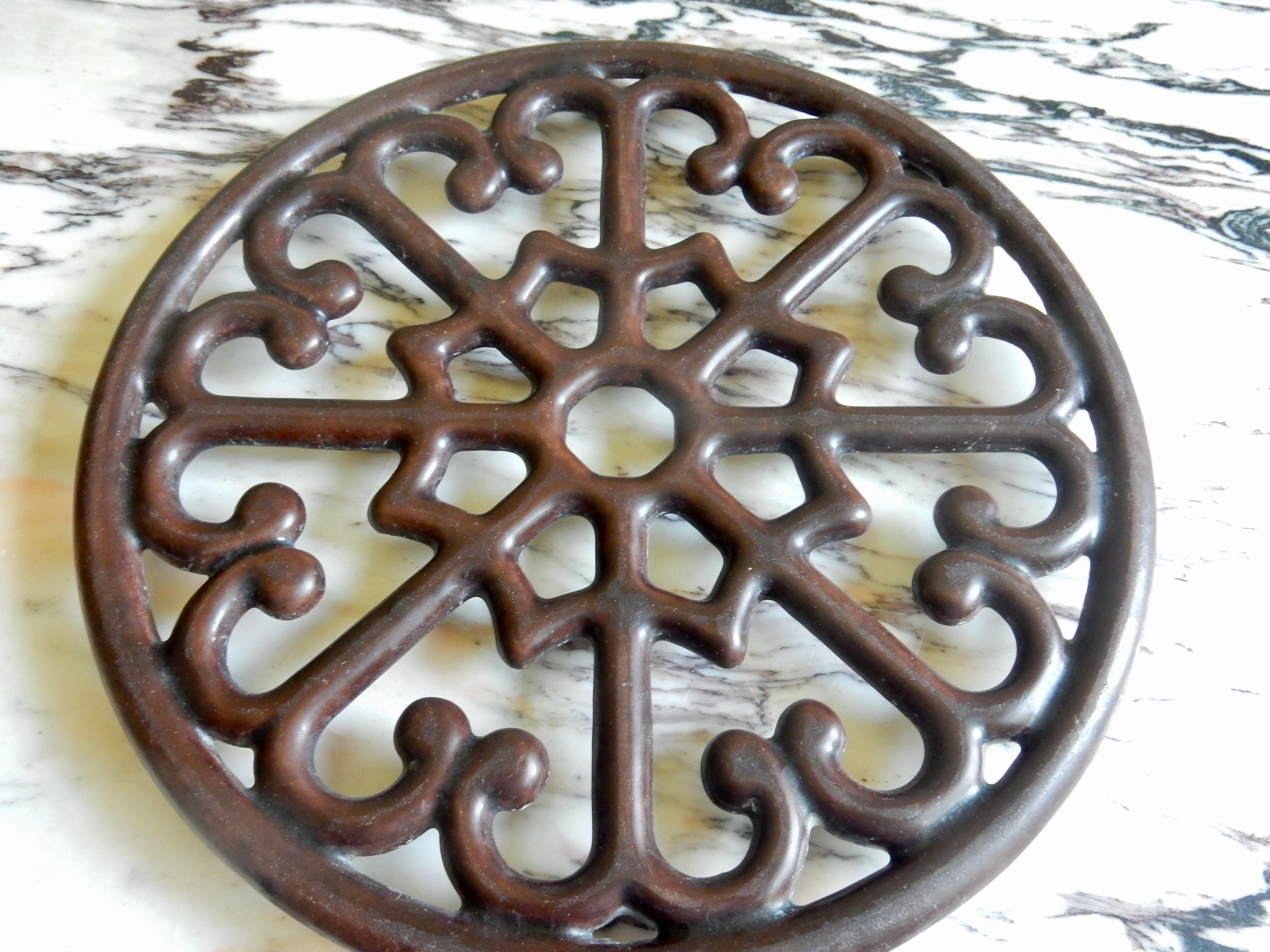 Brown enamelled cast iron trivet