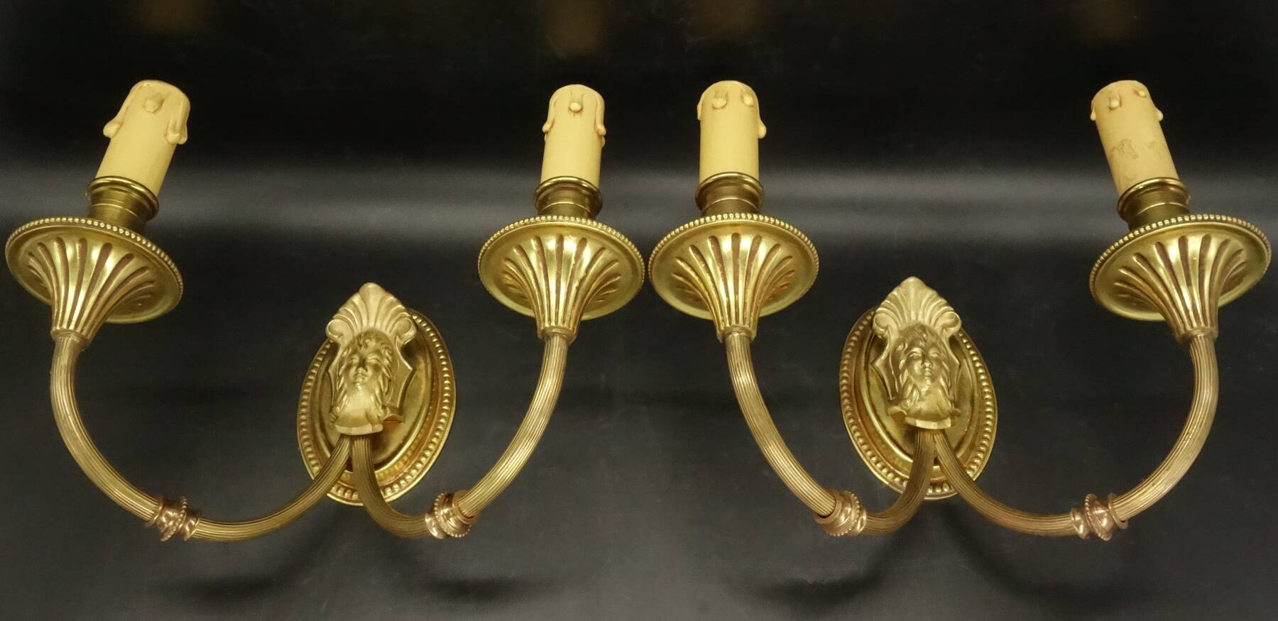 Pair of wall sconces with female masks in Louis XVI style - gilded bronze