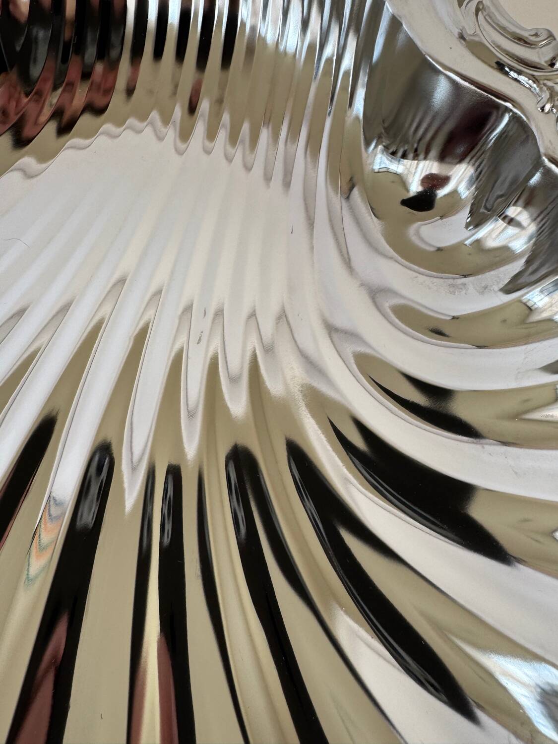 Large silver-plated serving dish in the shape of a vintage shell.