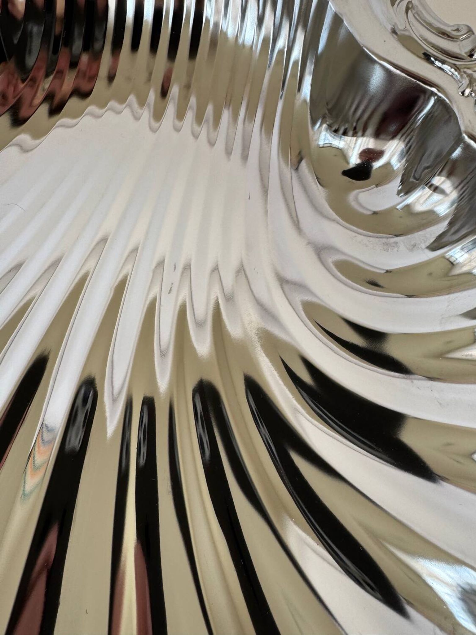 Large silver-plated serving dish in the shape of a vintage shell.