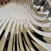 Large silver-plated serving dish in the shape of a vintage shell.