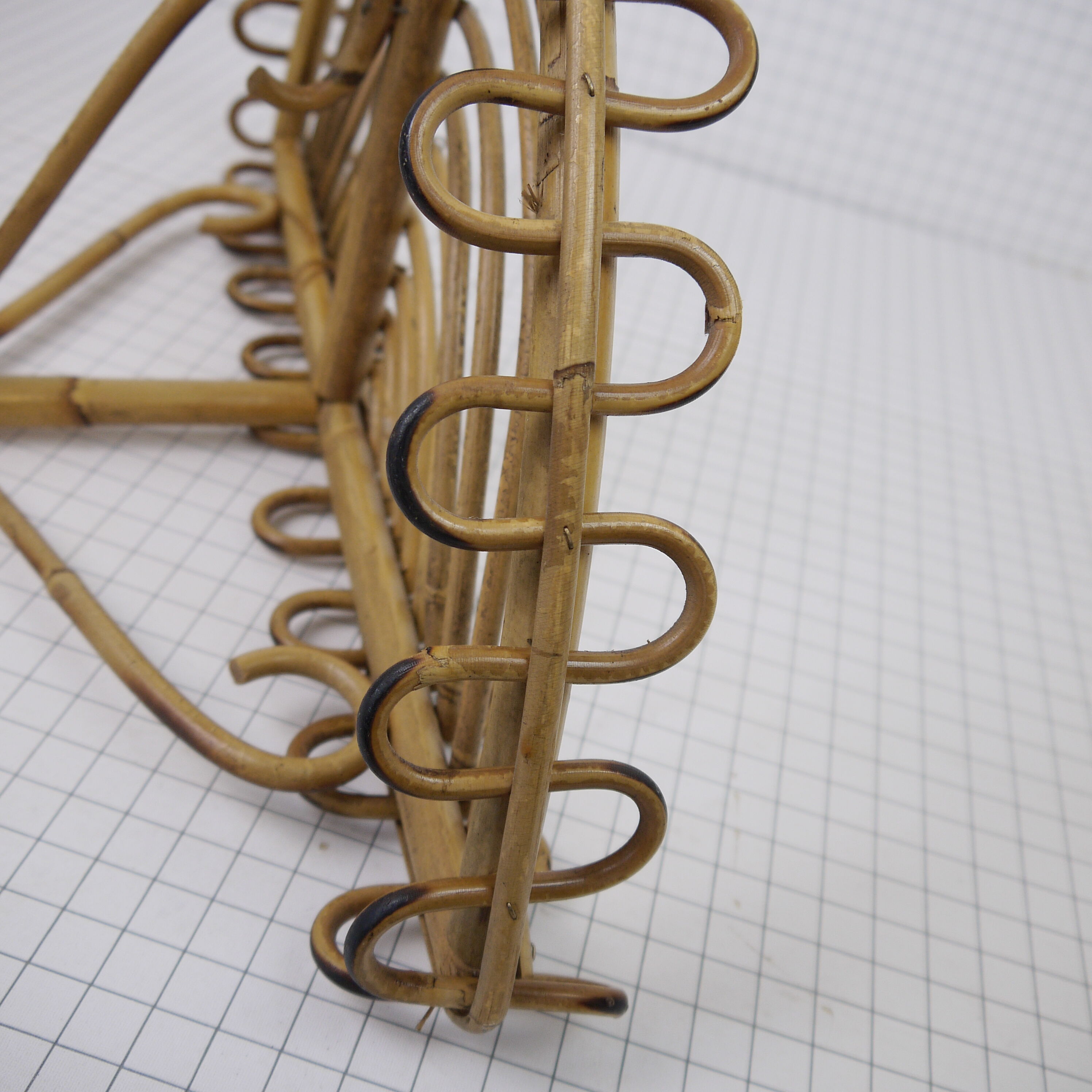 Half-moon rattan shelf and coat holder