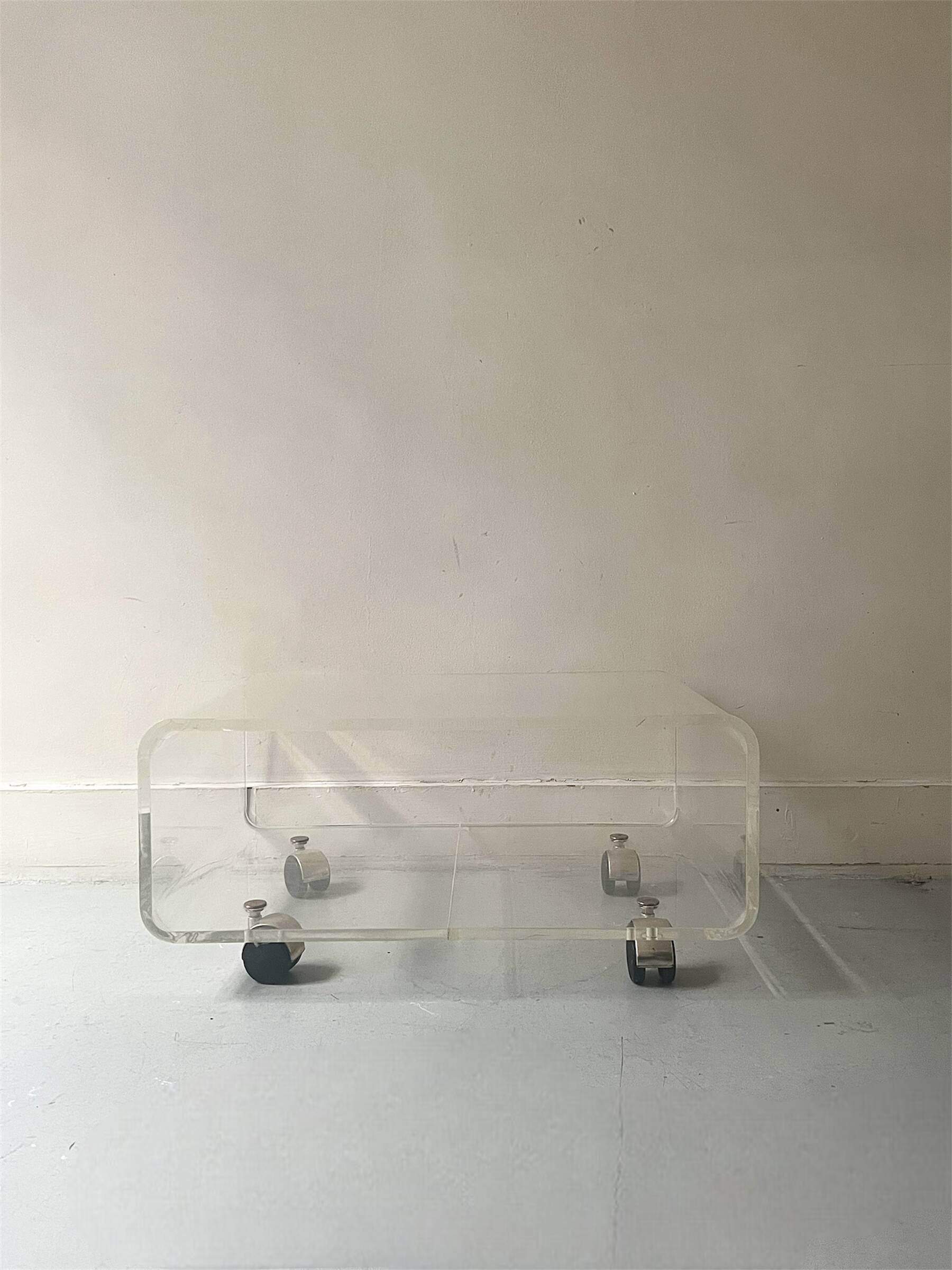 Transparent plexiglass coffee table by Roche Bobois, 1970s design.