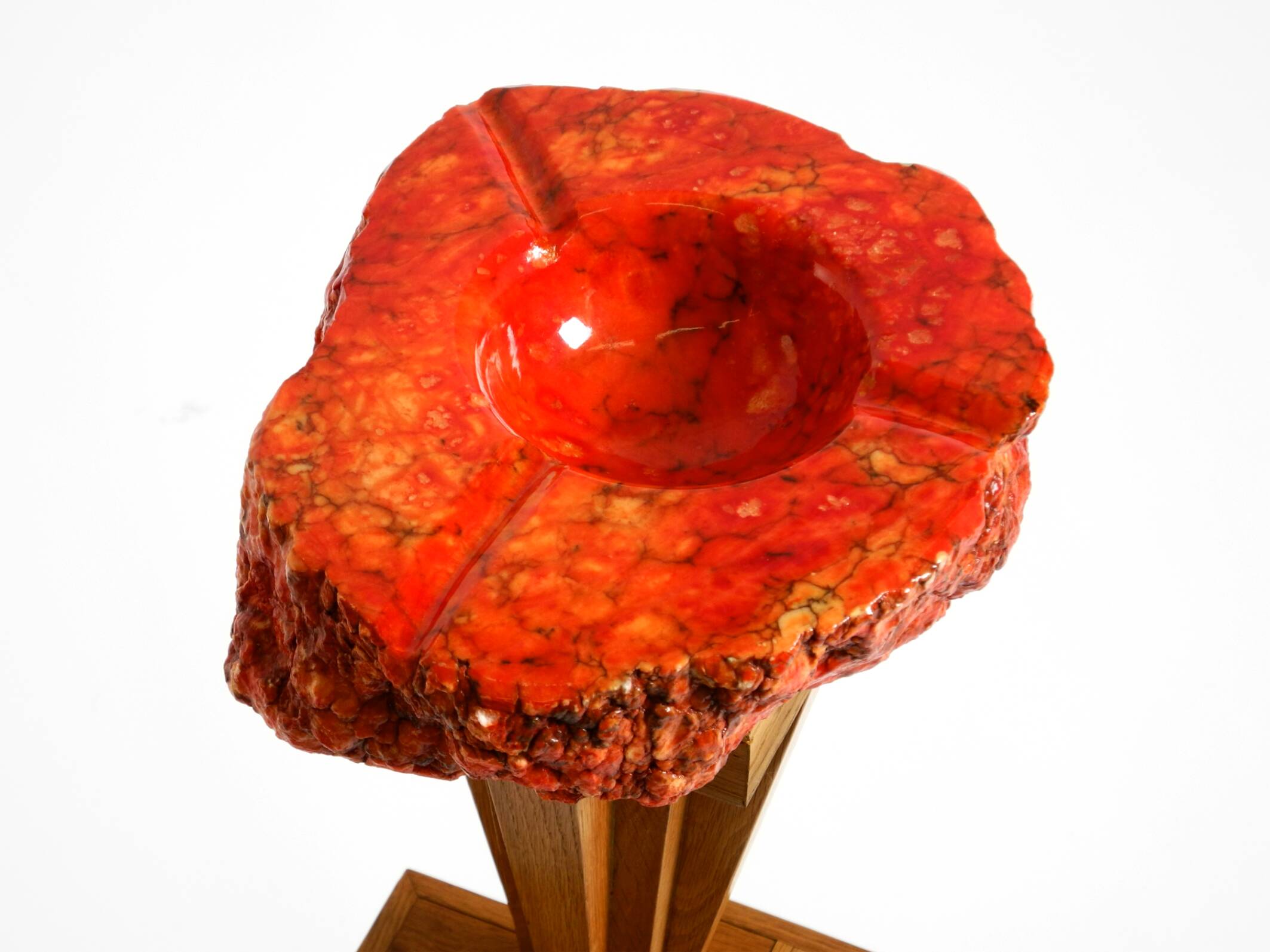 Two mid-century standing ashtrays consisting of red Alabaster cup