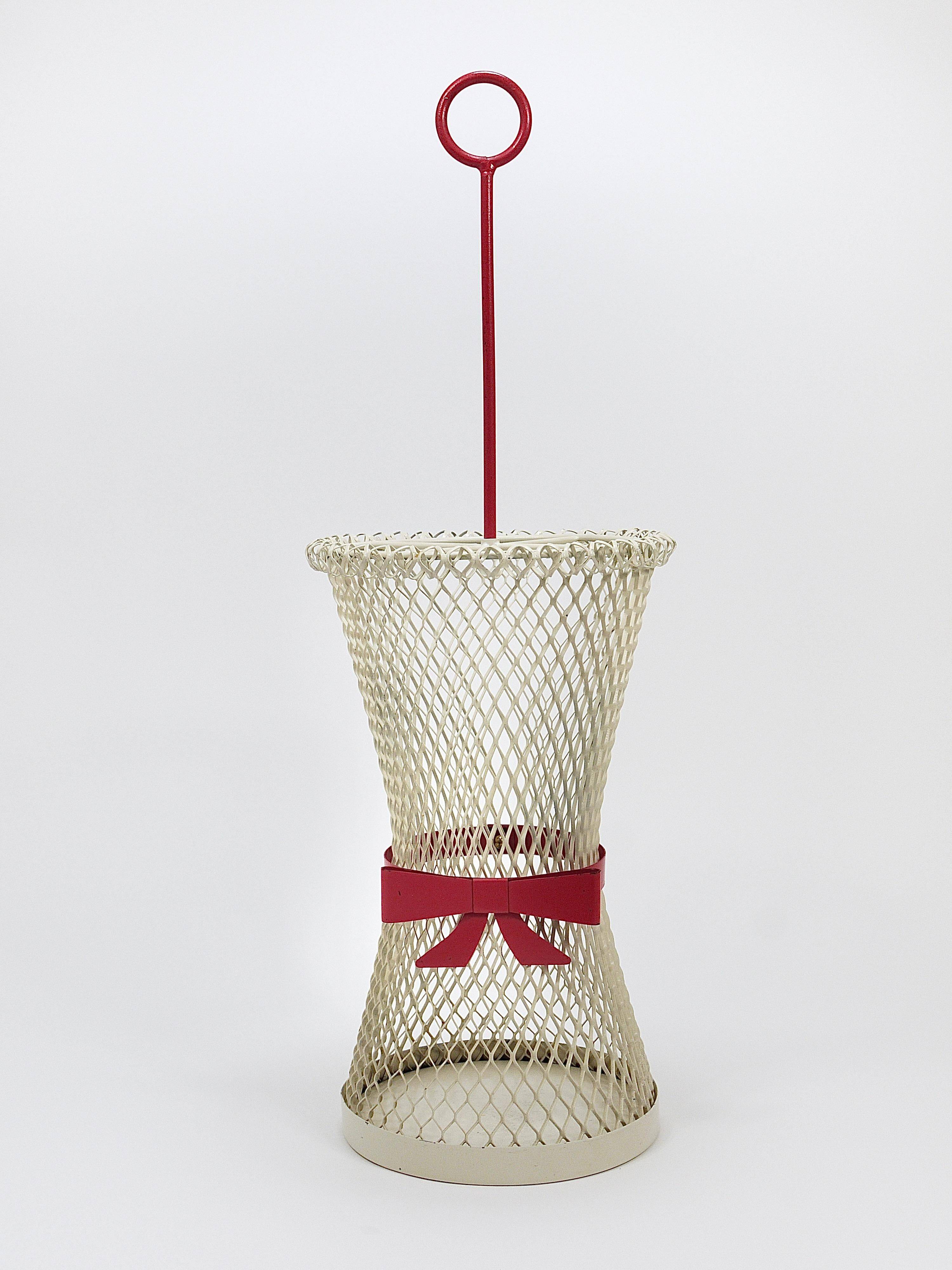 Bow tie umbrella stand in the style of Mathieu Matégot, mid-century, metal, France, 1950s.