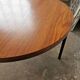 Round coffee table in walnut veneer and metal