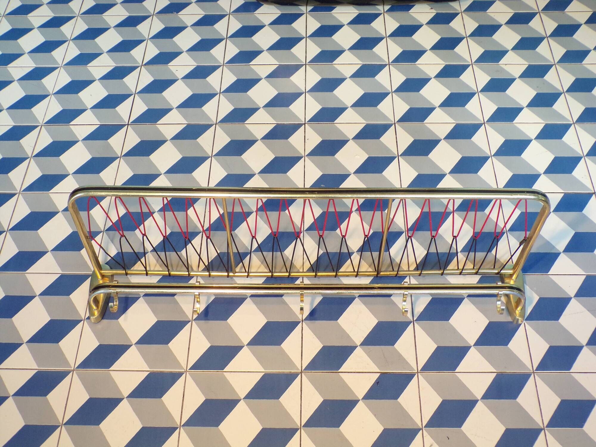 Coat rack styled like a train luggage rack, length = 81 cm.
