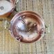 Copper and brass strainer lion's leg